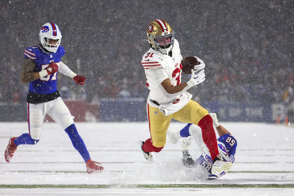 Isaac Guerendo #31 of the San Francisco 49ers runs the ball for a touchdown against the Buffalo Bills at Highmark Stadium on December 01, 2024 in Orchard Park, New York.